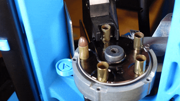 Spring enables a quick OAL or powder check by simply pulling out and reinserting the case in the desired station.